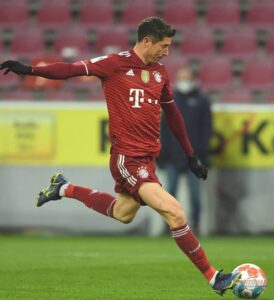 Rob Kicking a Football in FC Bayern Munich Jersey
