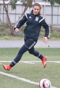 Nayeli Rangel with ball in field